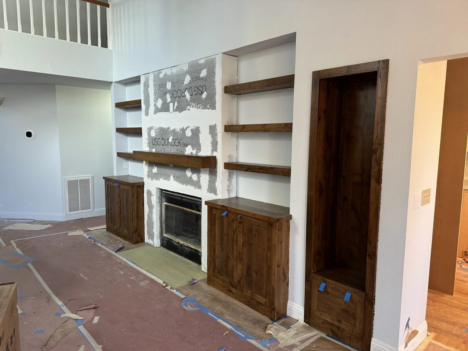 Custom walnut built-in shelving and floor-to-ceiling cabinetry around fireplace Reno NV