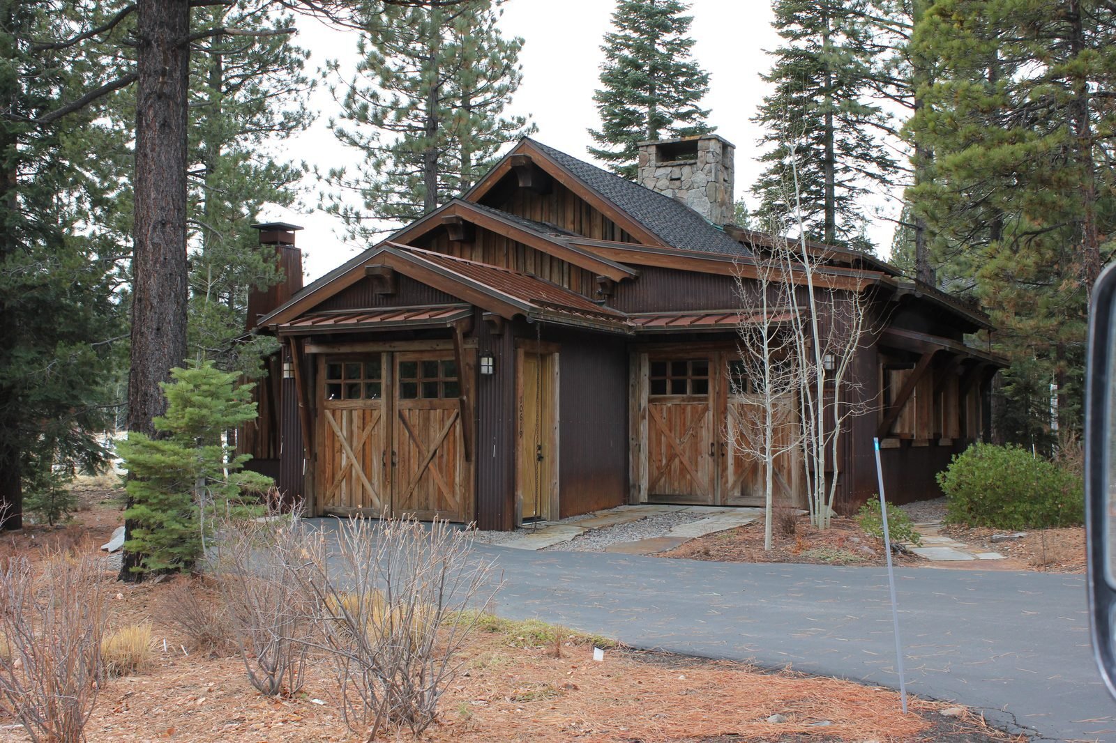 Detached garage custom barn style wood doors timber accents Truckee CA