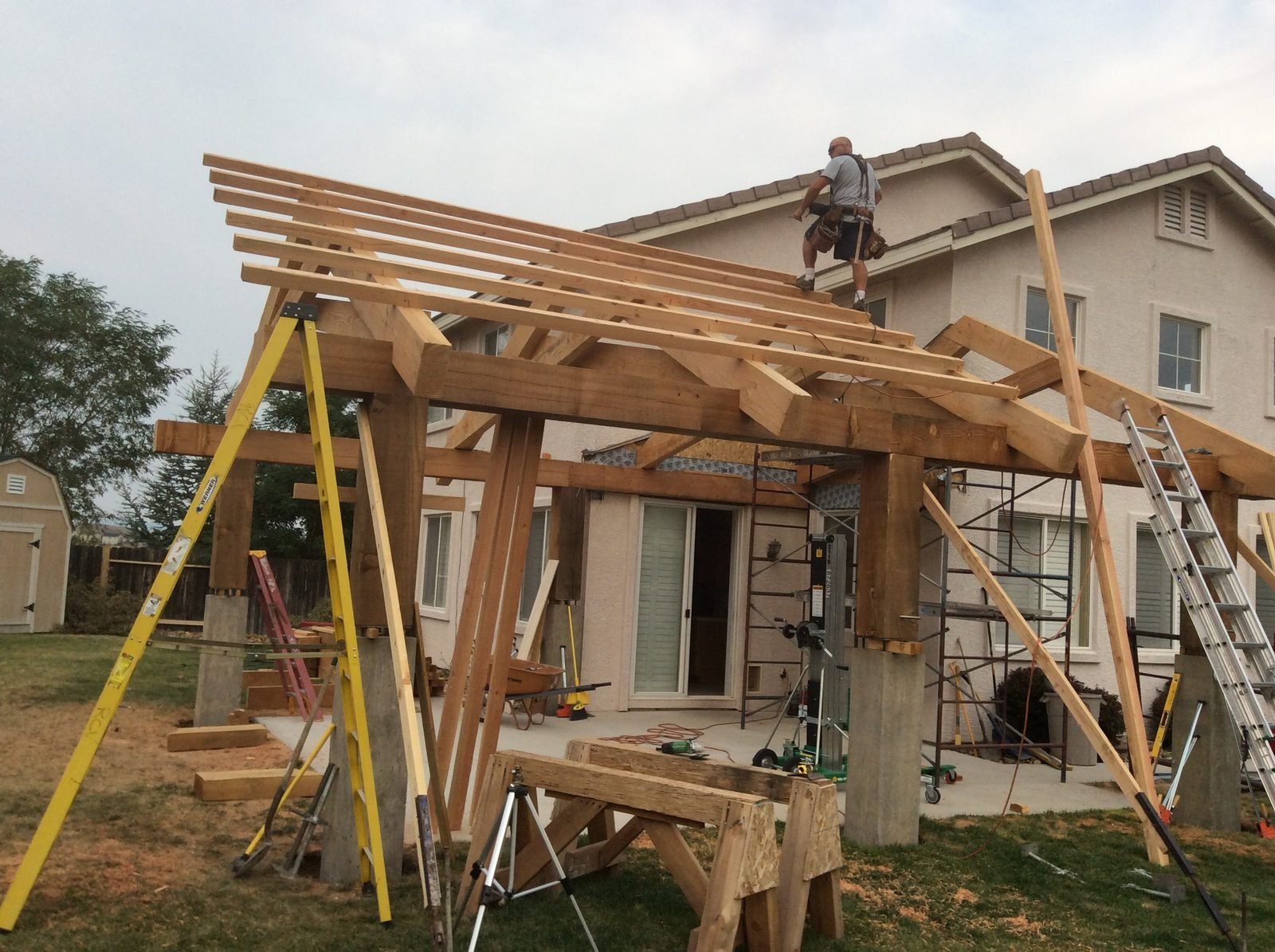 Timber patio cover framing with arched knee braces and rafters Reno NV